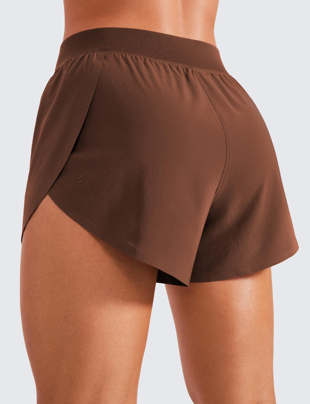 CRZ YOGA Mid Waisted Dolphin Athletic Shorts for Women Lightweight High Split Gym Workout Shorts with Liner Quick Dry Coffee Brown XX-Small