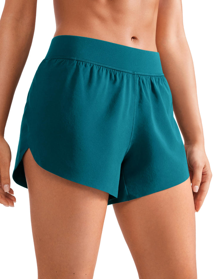 CRZ YOGA Mid Waisted Dolphin Athletic Shorts for Women Lightweight High Split Gym Workout Shorts with Liner Quick Dry Borealis Green XX-Small